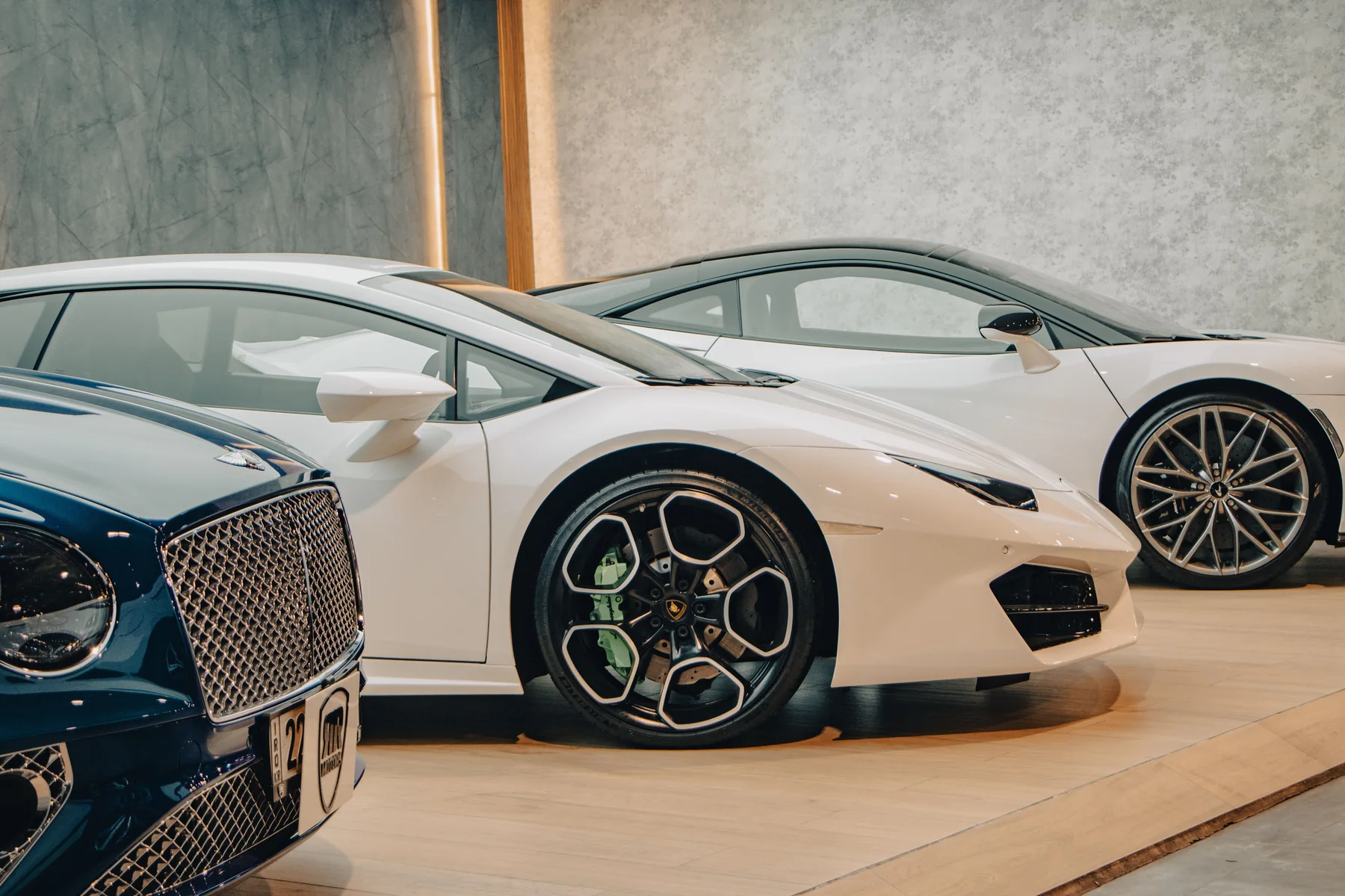 Premium vehicles displayed in a modern showroom
